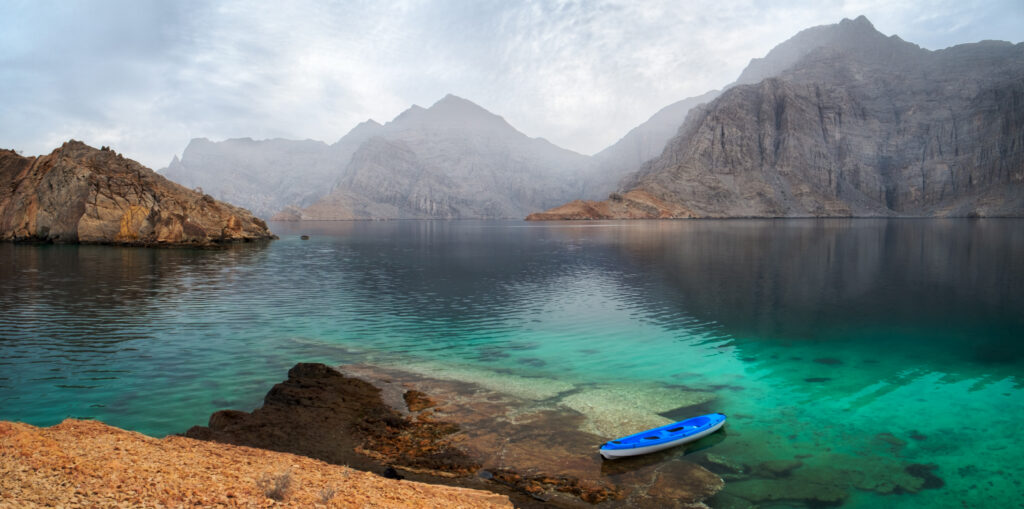 Sea tropical dawn landscape with mountains and fjords, Oman